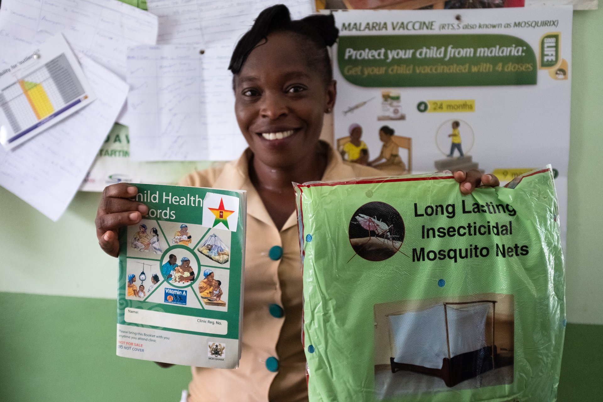 Children vaccinated against malaria in Ghana have a star sticker label on their record book